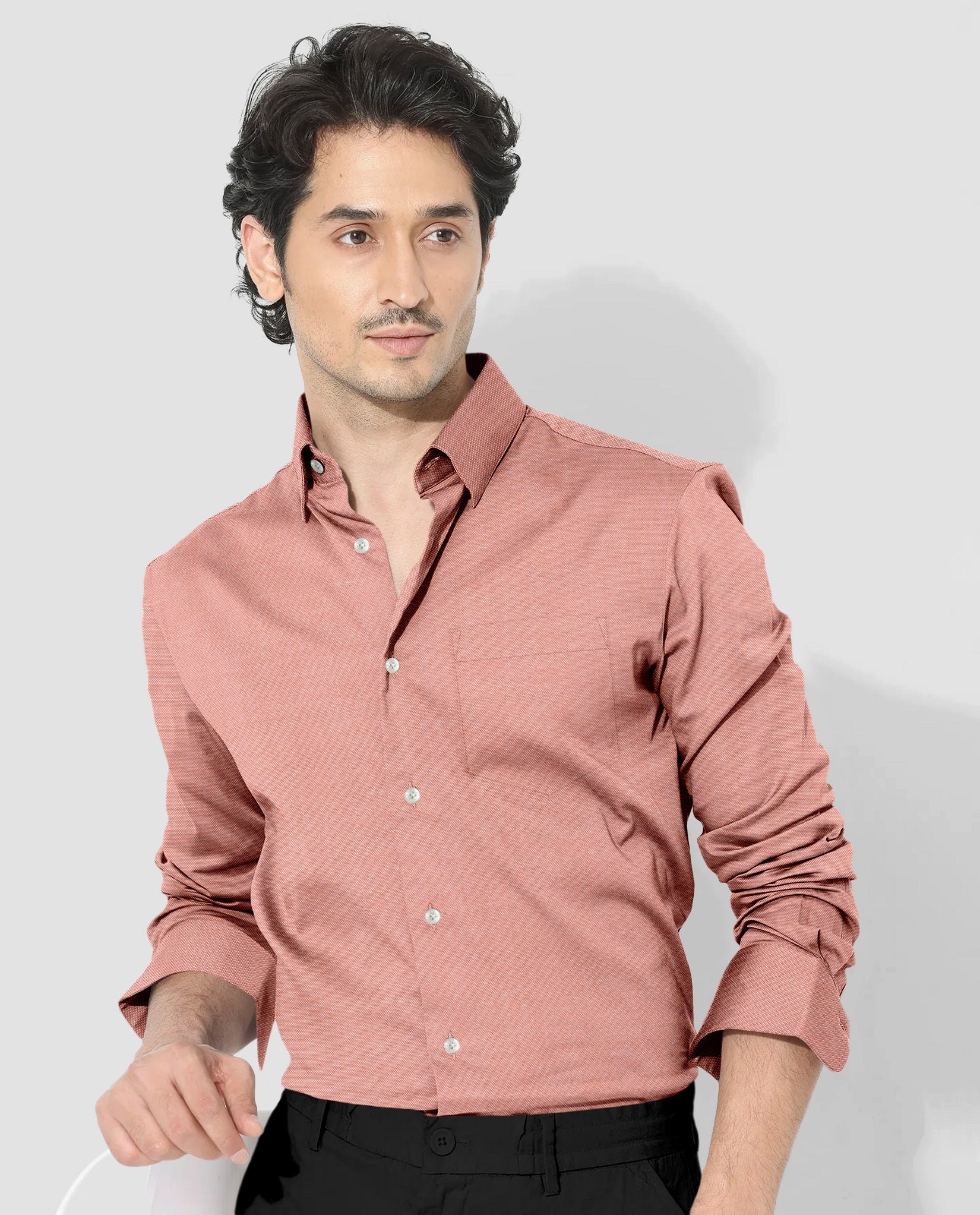 Man wearing a pink shirt against a light gray background-Celosia Orange Plain Oxford Cotton Formal Shirt