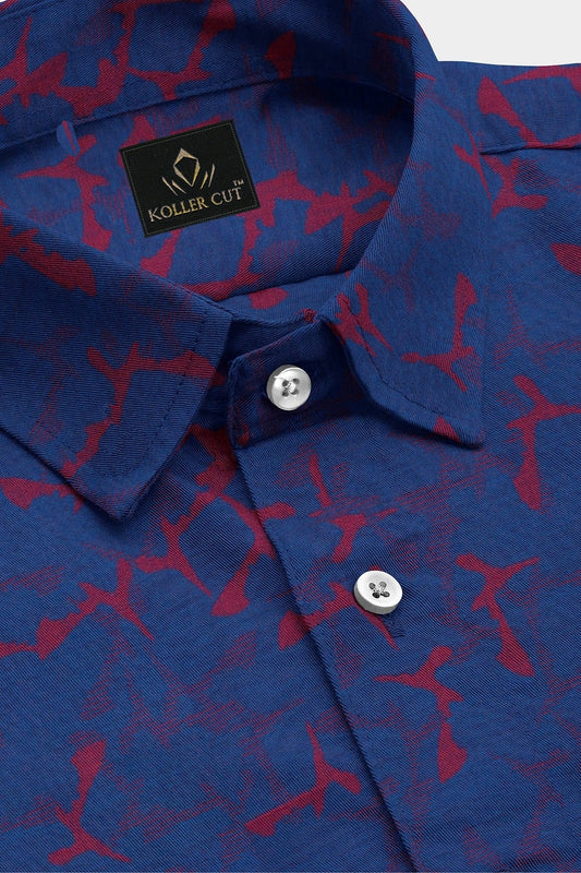 Close-up of a blue shirt with red pattern and Koller Cut label.Baleine Blue and Chilli Red Jacquard Print Egyptian Giza Cotton Shirt
